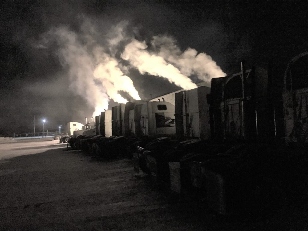 Multiple trucks parked early in the morning