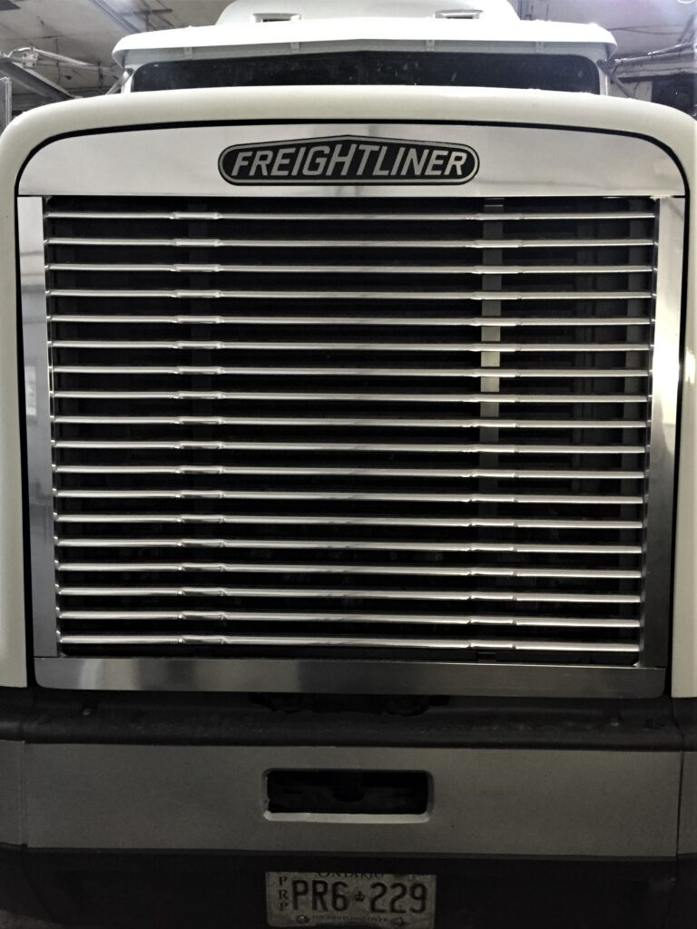 The front grill of a Freightliner truck